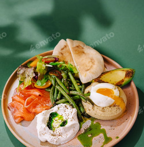Preview: Gourmet breakfast platter with poached eggs and salmon