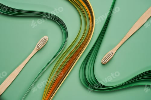 Preview: Bamboo toothbrushes on green background with quilling
