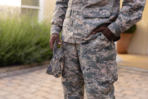 Preview: Person in Camouflage Uniform Outside