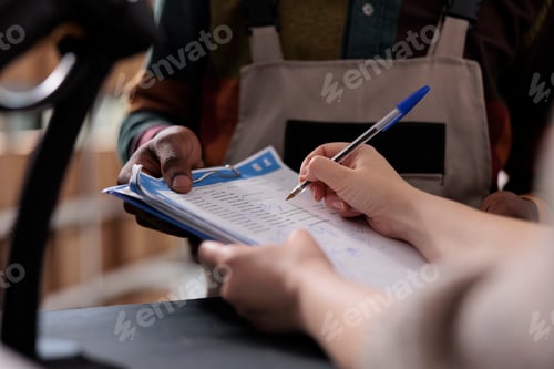 Preview: Storage room supervisor signing logistics report