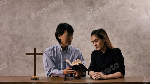 Preview: Young missionary is giving Bible advice to young woman in church.