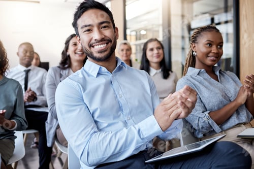Preview: Shot of a group of businesspeople clapping hands during a conference