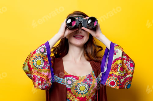 Preview: Young hippie girl with binoculars