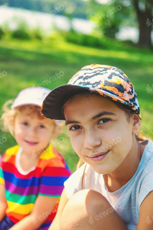 Preview: Child girl on a picnic in the park. Selective focus.