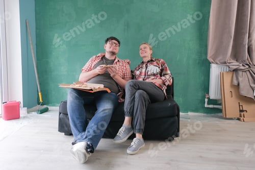 Preview: Couple Eating Pizza in Newly Painted Home