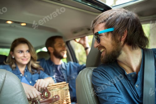 Preview: A group of people inside a car, on a road trip.