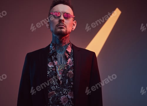 Preview: Caucasian macho in black suit with shirt in dark and colourful room