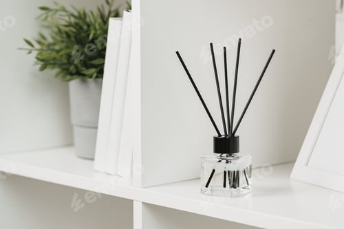 Preview: Elegant Reed Diffuser on White Shelf in a Modern Minimalist Interior Setting
