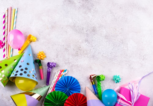 Colorful Birthday Party Decorations on Grey Background
