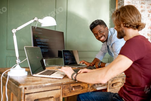 Preview: Programmers working with program code