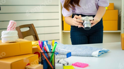 Preview: Startup small business SME, Entrepreneur owner taking pictures, measuring the size of the skirt. Tha