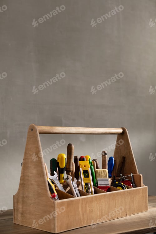 Preview: Construction tools and toolbox at wooden table background texture. Tools kit and tool box