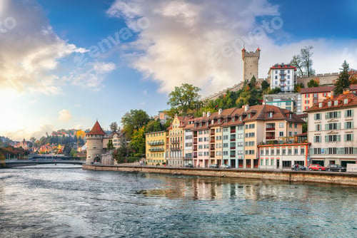 Preview: Outstanding historic city center of Lucerne with famous buildings and Nolliturm tower on Reuss river