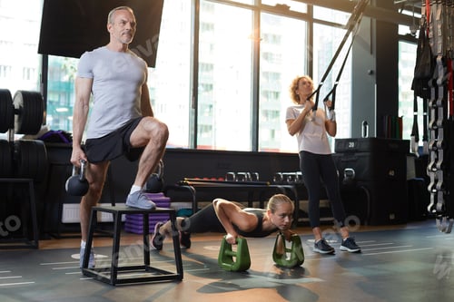 Preview: People training in gym