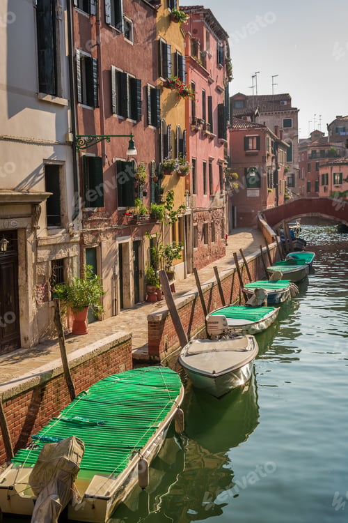 Preview: Few boats on a canal in Venice