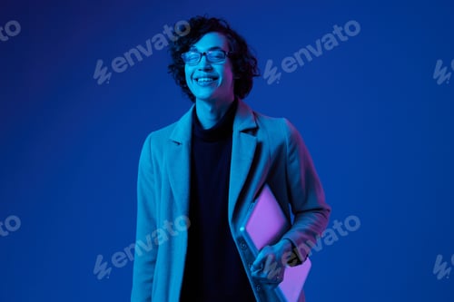Preview: man with a laptop in his hands and a jacket, a smile, futuristic glasses in blue light, Blue