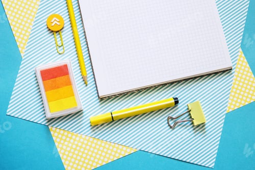 Preview: School supplies. Yellow and blue colors. Empty notebook. Flat lay composition. Space for text.