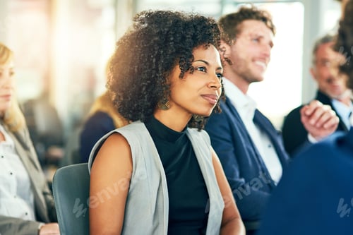 Preview: Cropped shot of an attractive young businesswoman sitting in a conference room during a seminar