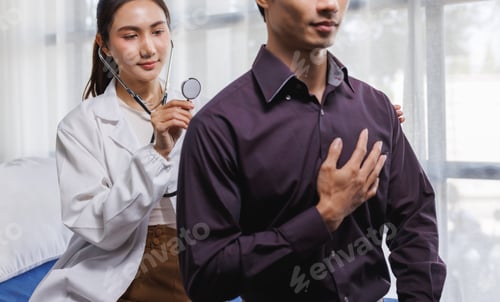 Preview: Doctor examining male patient heart with stethoscope