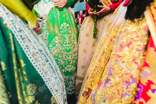 Preview: Traditional Spanish Valencian Fallera dress, colorful fabrics with intricate embroidery.