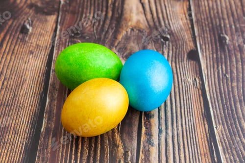 Preview: Close-up. Beautiful colorful Easter eggs. Easter concept on dark wooden background