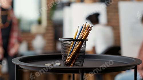 Preview: Colorful pencils and erasers on table used to draw artwork