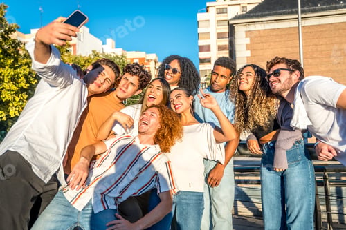 Preview: Smiling friends enjoying a day at city taking selfie together