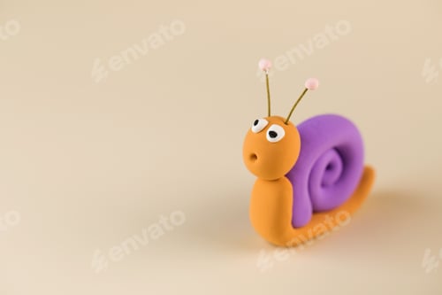 Preview: Funny figurine of a snail made of polymer clay. Copy space.