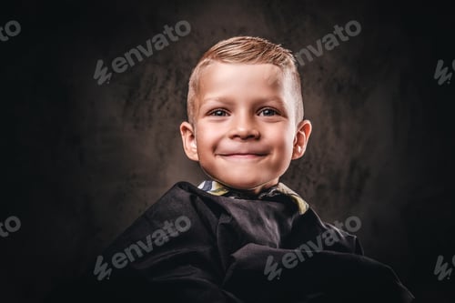 Preview: Cute preschool boy getting haircut.