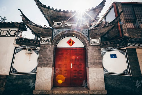 Preview: Exterior view of front door and roof of a traditional Chinese residential building.
