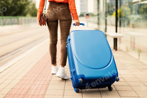 Preview: Cropped Shot Of Lady Tourist Walking With Travel Suitcase Outdoor