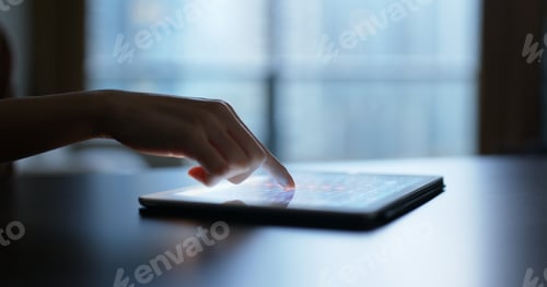 Preview: Woman touch on the screen of tablet computer