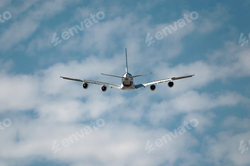 Preview: Passenger jet plane soars through a cloudy sky, symbolizing travel and freedom