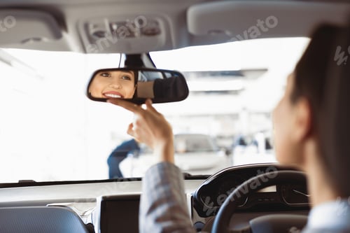 Preview: Girl Checking Mirrors Sitting In Driver's Seat