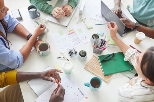 Preview: Business Team at Meeting table Above View