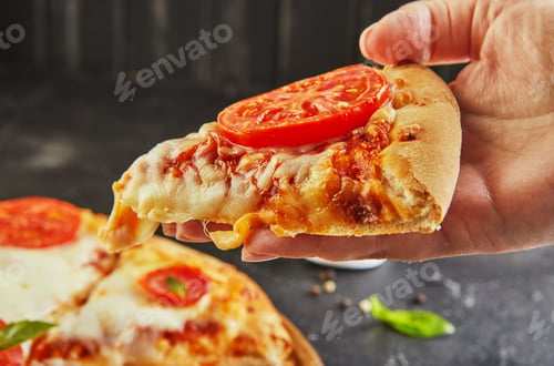 Preview: The delicious taste of pizza and slices of cheese with mozzarella and tomatoes.