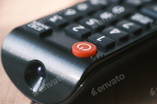 Preview: detail shot of tv remote on table
