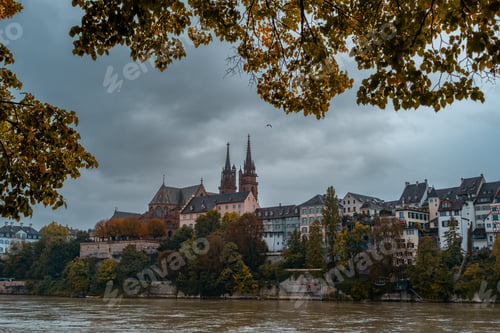 Preview: Cathedral Munster above the Rhine river during rain and with fall autumn
