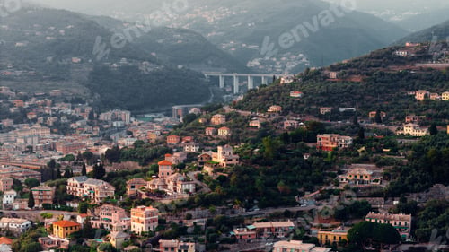 Preview: Camogli cityscape nestled on ligurian hills overlooking the valley at sunset