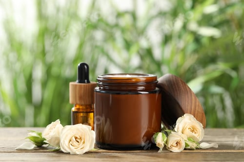 Preview: Different hand care cosmetic products and roses on wooden table