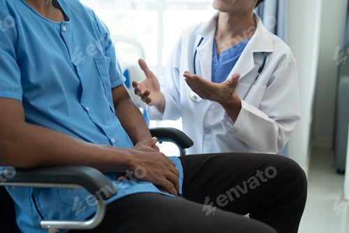Preview: Friendly Male Doctor Talks to Male Patient. doctor with chart attending sick man in hospital ward.