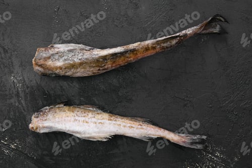 Preview: Frozen pollock carcass on wooden table