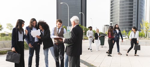 Preview: successful businessmen by office building, multiracial people of different ages