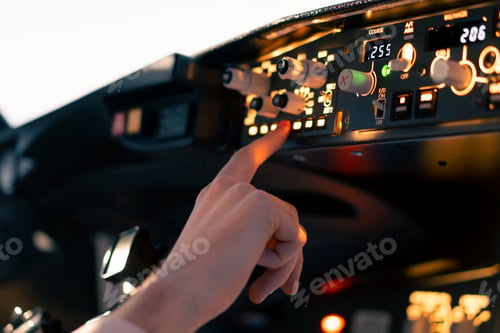 Preview: close-up hand of the pilot captain presses the buttons on the control panel to start engine of plane