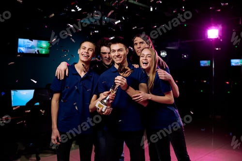 Esports Team Celebrates Championship Victory with Trophy