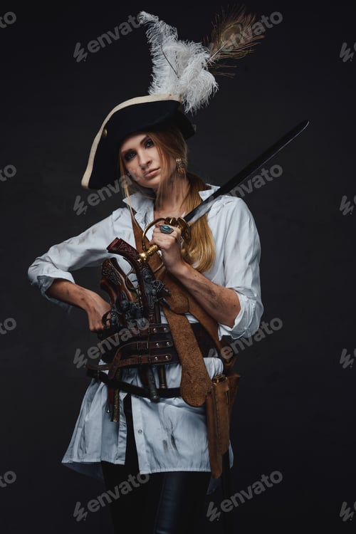 Preview: Studio shot of woman corsair with saber and guns