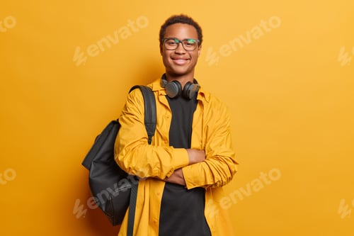 Preview: People and happiness. Studio shot of young glad smiling African american student standing in centre