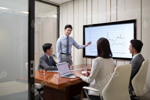Preview: Chinese business people having meeting in conference room
