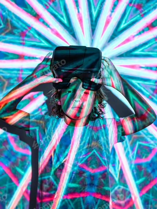 Preview: Boy with VR headset under bright projector light