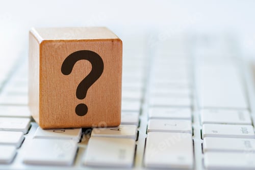 Preview: Small wooden dice with question mark on keyboard
